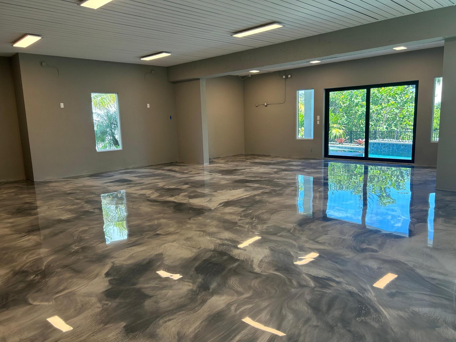 epoxy grey floor with a big glass window behind
